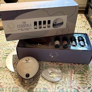 Pure Tranquility The Essentials. Gently used essential oil diffuser